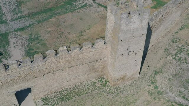 Belgorod-Dnestrovskaya fortress from a bird's eye view. The largest fortress in Ukraine is located on the Dniester River. Green blooming water and white-stone walls of the fortress.