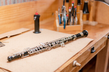 musical instrument maintenance, clarinet cleaning in wind instrument workshop