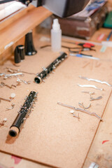 musical instrument maintenance, clarinet cleaning in wind instrument workshop