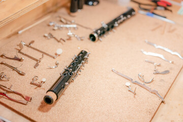 musical instrument maintenance, clarinet cleaning in wind instrument workshop