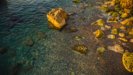 rocky coast of the mediterranean sea at dawn