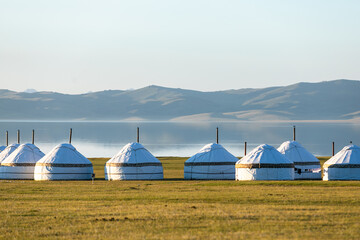 Traditional Central Asia nomad yurts on the lake shore. High quality photo - obrazy, fototapety, plakaty