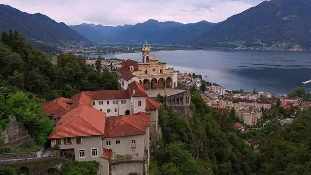 Aerial drone footage of the famous Madonna del Sasso church overlooking Locarno in Canton Ticino in Switzerland