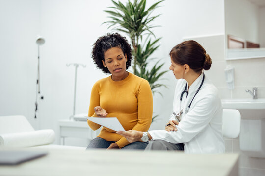 Patient And Doctor Discussing Test Results.