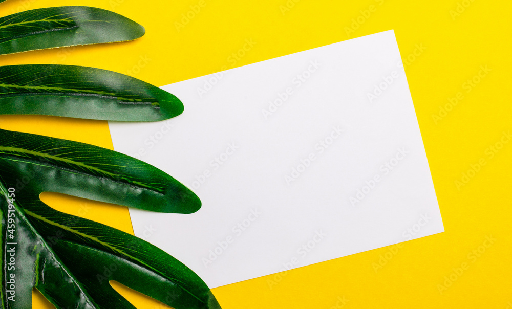 Poster white blank sheet of paper with a place to insert text or illustrations on a bright yellow backgroun