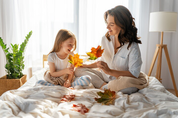 girl and mother enjoying sunny morning