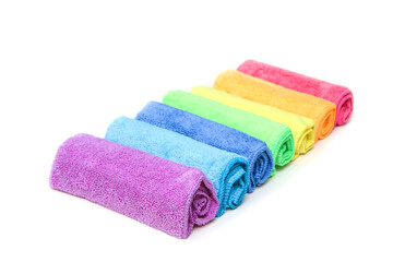 The row of the different colorful micro fibre rags ordered in a white background. 