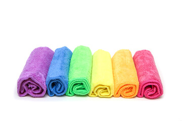 The row of the different colorful micro fibre rags ordered in a white background. 