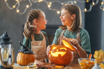 girls with carving pumpkin