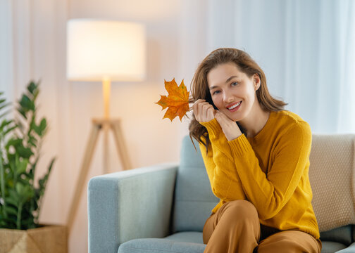 woman resting on sofa at home