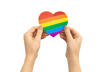 Heart in LGBT rainbow colors in hands isolated on a white background photo