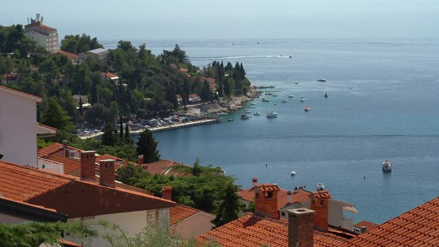 Arial view of the sea bay, on a summer sunny day, the movement of boats, Rabac, Istra, Croatia.