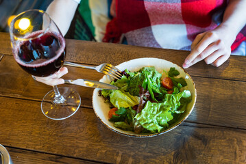 woman eating salad in the restaurant