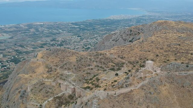 Aerial view of Acrocorinth "Upper Corinth" the acropolis of ancient Corinth, Greece. It is a monolithic rock overseeing the ancient city of Corinth