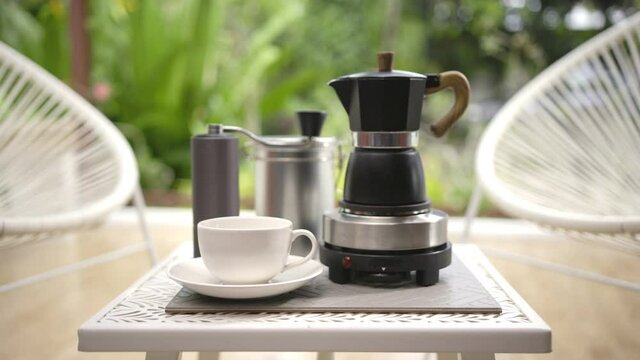 Morning coffee with moka pot on the terrace