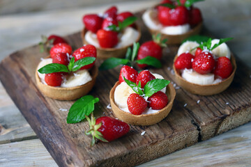 Delicious tartlets with strawberries and banana. Healthy dessert.