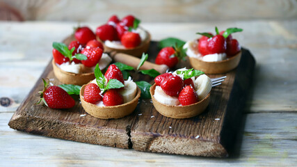 Delicious tartlets with strawberries and banana. Healthy dessert.
