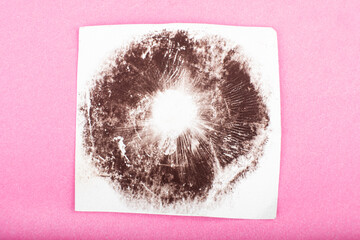 print from mushroom spores on a pink background close-up, psilocybe cubensis magic mushroom