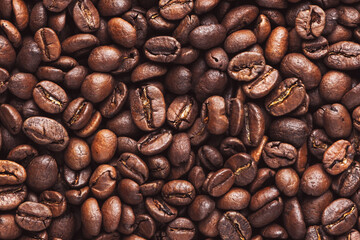 Coffee beans. Roasted coffee beans background. Top view coffee beans, close up beautiful for coffee shop texture background.