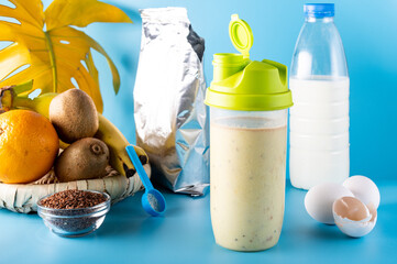 Protein powder and fruit. Protein and milk packaging. Milk products. Protein drink in a shaker.