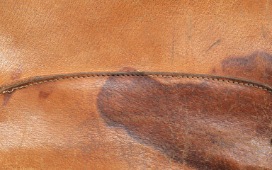 Fototapeta premium old scratched worn orange leather background and texture
