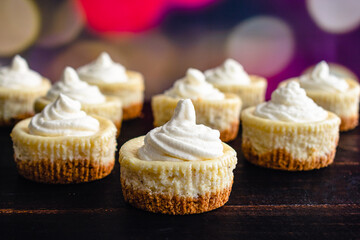 Mini Eggnog Cheesecakes Topped with Whipped Cream: Eggnog cheesecake cupcakes with a Christmas...