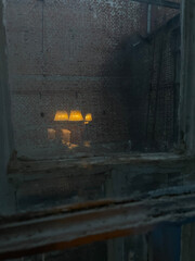Reflection of a floor lamp in an old window. Abstract background