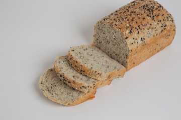 sliced bread isolated on white background. Top view of bread with different seeds. Crunchy french baguette breads
