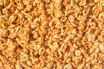 Oatmeal puffed with honey for a healthy nutritous breakfast - detail pile