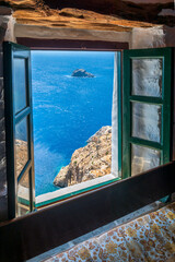 view from the famous Hozoviotissa Monastery standing on a rock over the Aegean sea in Amorgos island, Cyclades, Greece. - obrazy, fototapety, plakaty