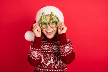 Portrait of attractive cheerful girl touching wearing festal specs eve christmastime isolated over...