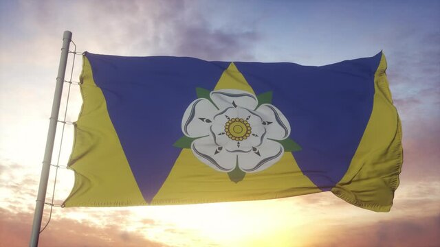 West Yorkshire flag, England, waving in the wind, sky and sun background