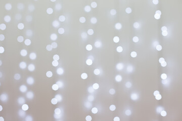 Transparent Christmas tree toy and snowflake on the background of garlands. Christmas background. Decorations for the Christmas tree. White background for new year.