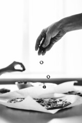 Family cooks pizza at home, hands close-up