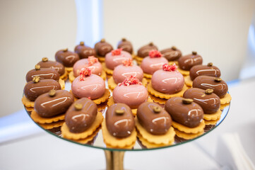 Sweet cakes at a wedding buffet. Catering