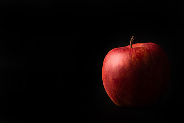 Fototapeta na wymiar Apples, a beautiful apple arranged on black background, Low Key portrait, selective focus.