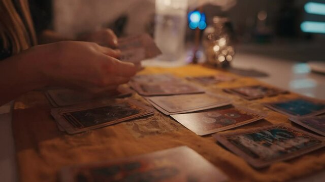 Fortune teller female hands and tarot cards