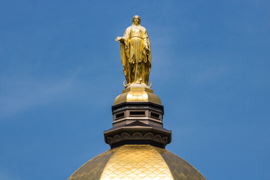 Mary stands atop the Golden Dome of the University of Notre Dame Main Administration Building.
