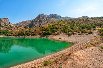 Amazing emerald mountain lake among the forest, Crimea
