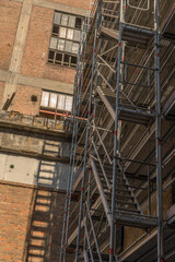 Scaffolding on the facade of a former factory