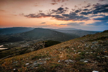 Scenic mountain landscape at sunset. Colorful travel background.