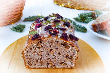 Christmas cake decorated with cranberries and powdered sugar