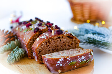 Christmas cake decorated with cranberries and powdered sugar