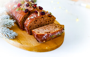 Christmas cake decorated with cranberries and powdered sugar