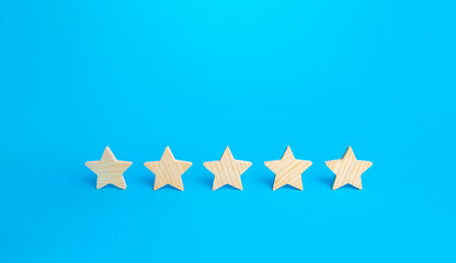 Five stars on a blue background. Rating evaluation concept. High satisfaction. Good reputation....