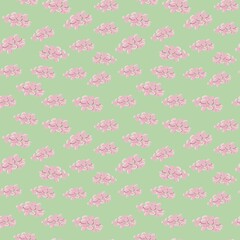 small pink flowers in a pattern on a green background.