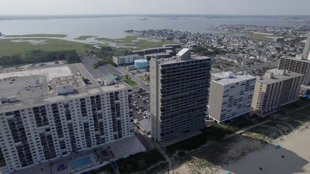 Drone moving parallax over Ocean City MD high rise ocean background