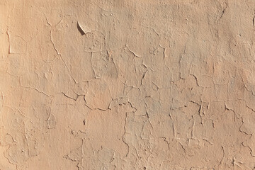 background of yellow-pink plaster on the wall