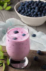 Homemade blueberry yogurt smoothie. Protein shake with berries. Vertical image