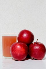 glass of red apples and apples